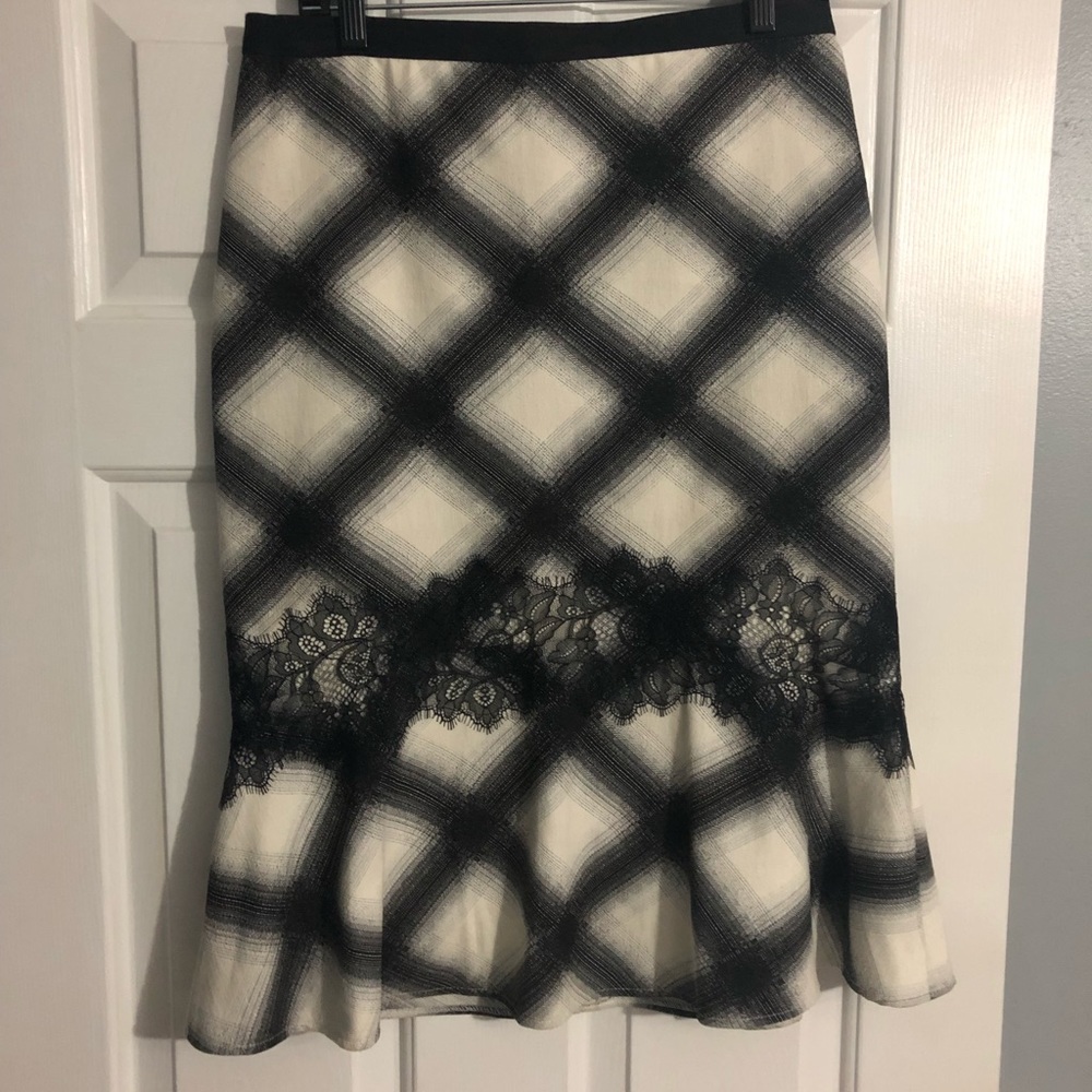 Beautiful mermaid BCBG skirt with lace trim.